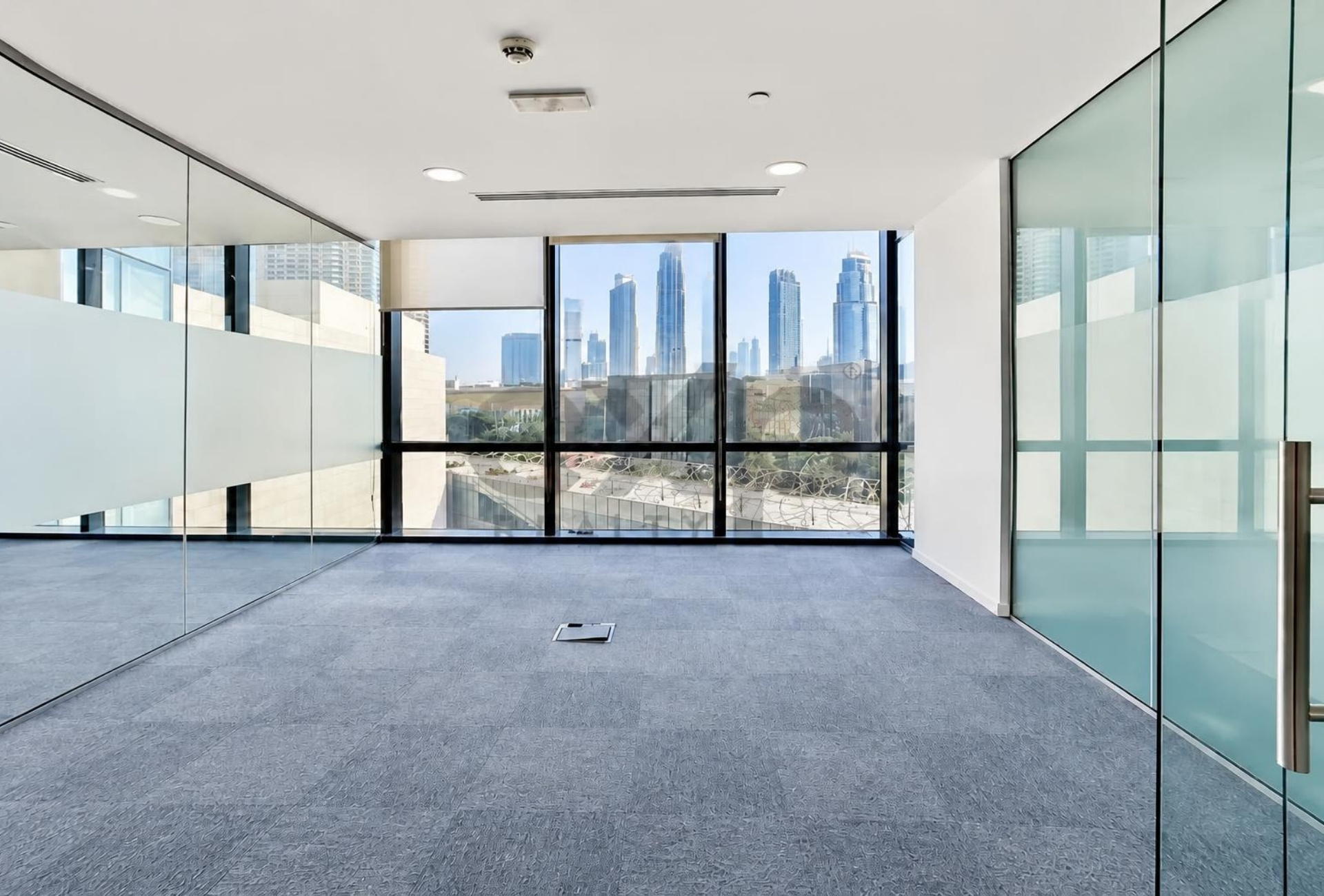 Glass partition with skyline view in Boulevard Plaza 2 office