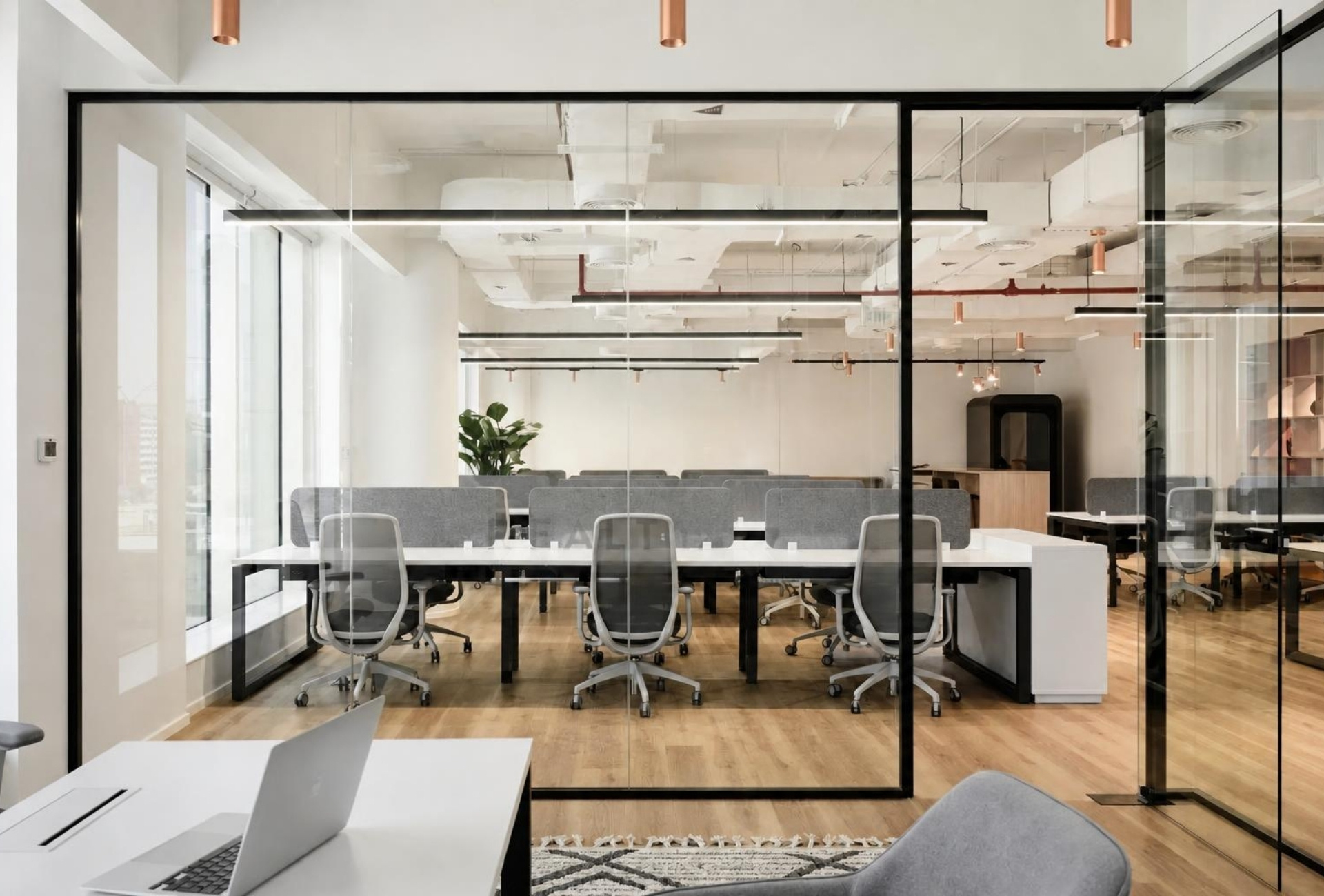 Glass partitioned workspace in Emaar Business Park office