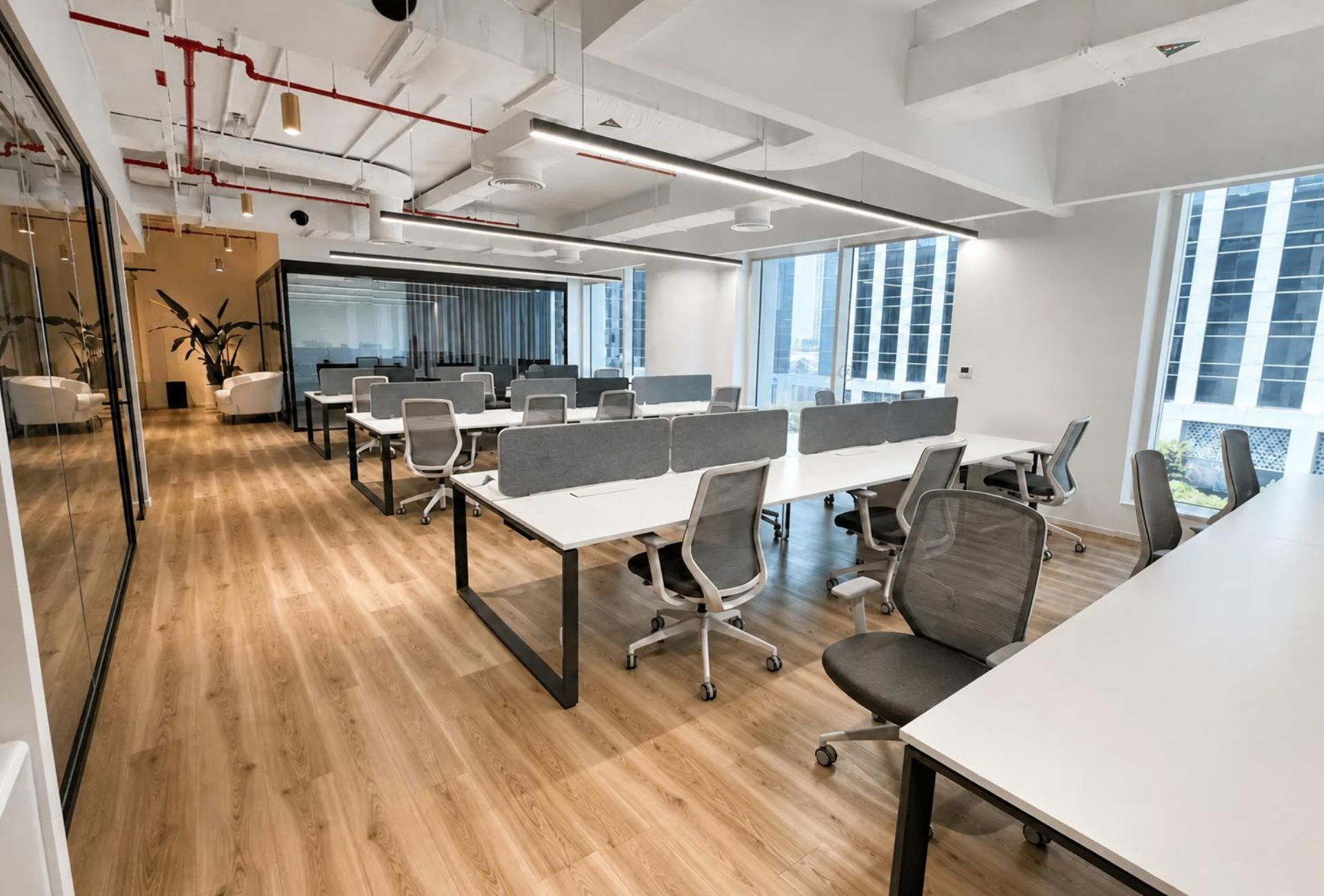 Desk rows with city light in the Emaar Square Building 3 office