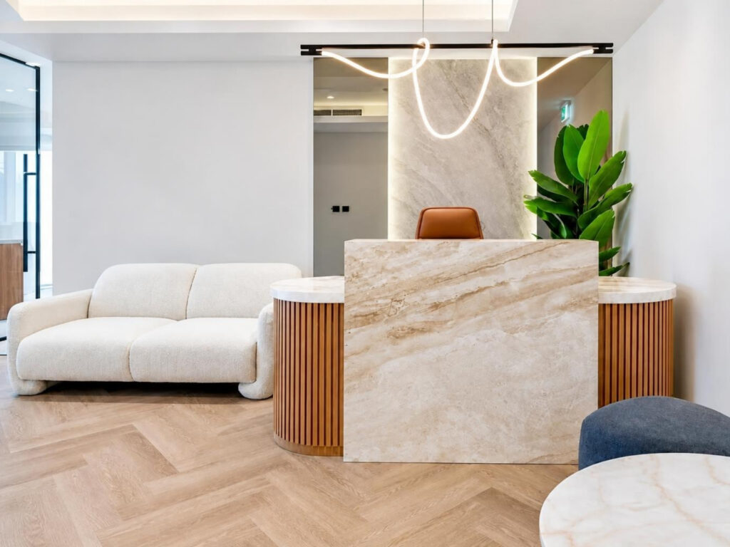 Furnished office for rent in Magnum Opus Bay, reception area with lounge seating