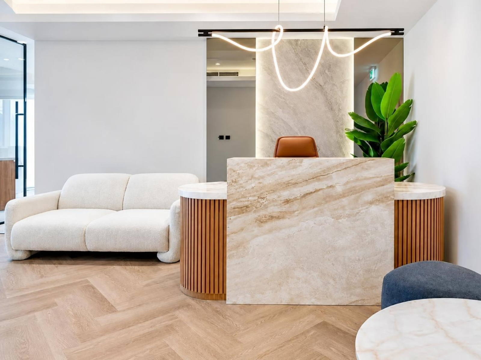Furnished office for rent in Magnum Opus Bay, reception area with lounge seating