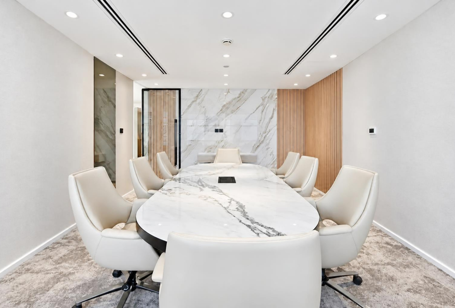Meeting room with oval table in Magnum Opus Bay office