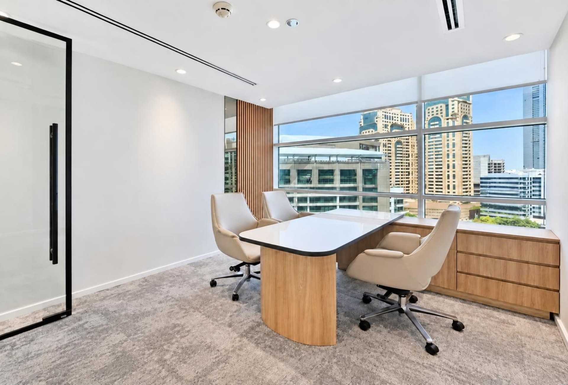 Private office with desk and two chairs in Magnum Opus Bay