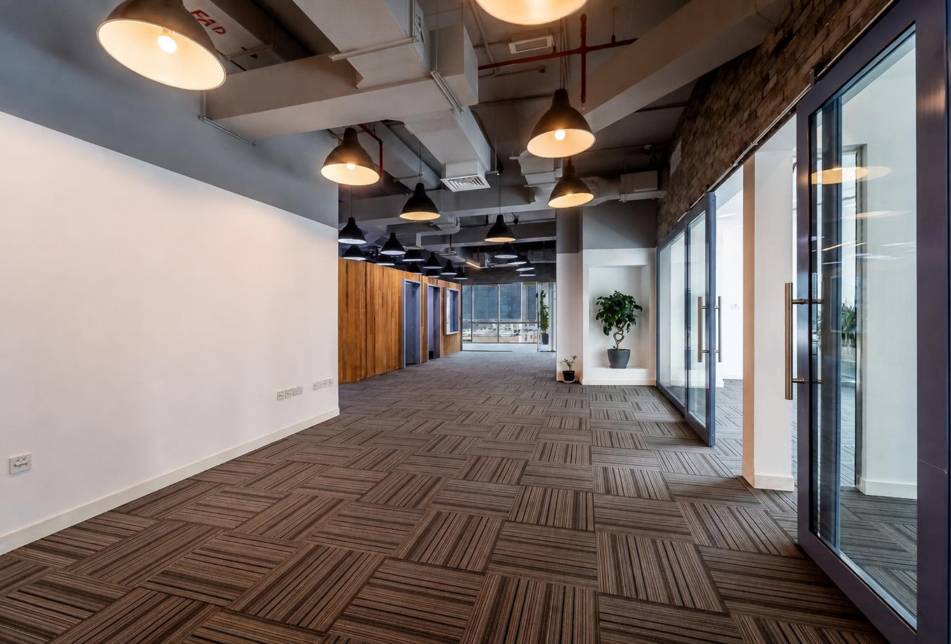 Open office corridor with glass partitions in Bay Square Building 6