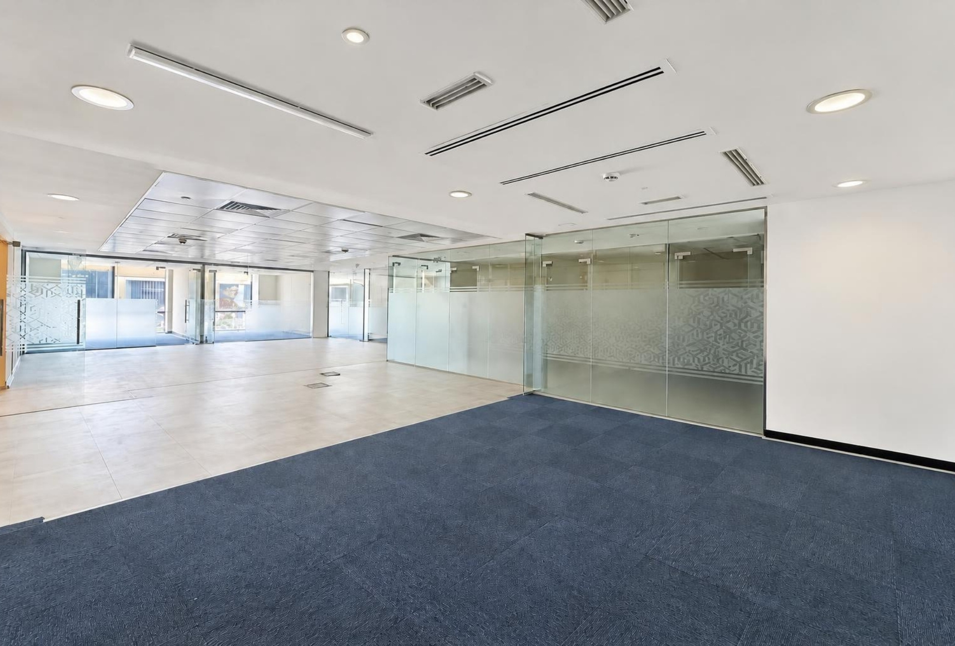 Glass-partitioned open floor in Boulevard Plaza 2 office