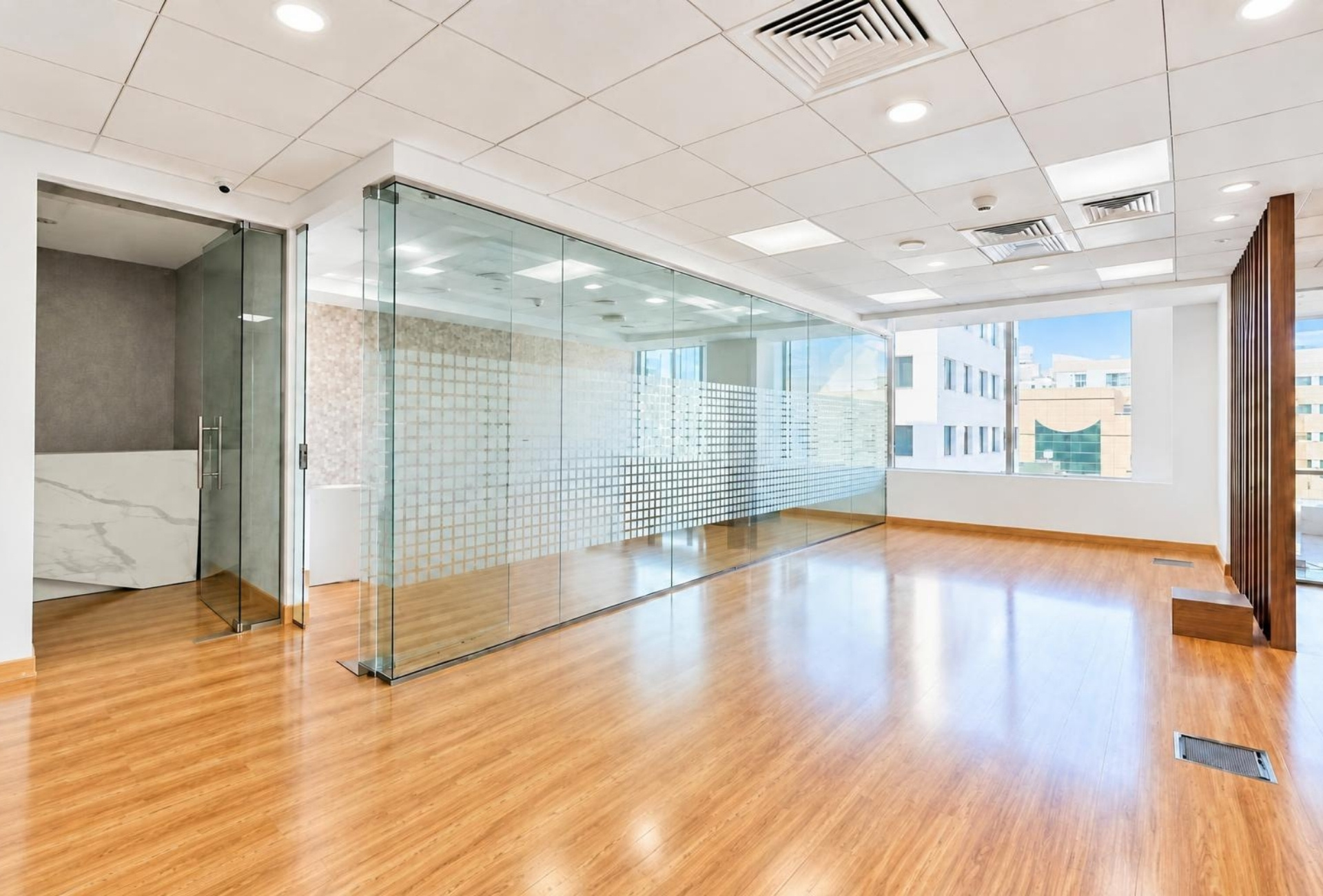 Open plan office space with glass partitions in Rigga Business Center Deira