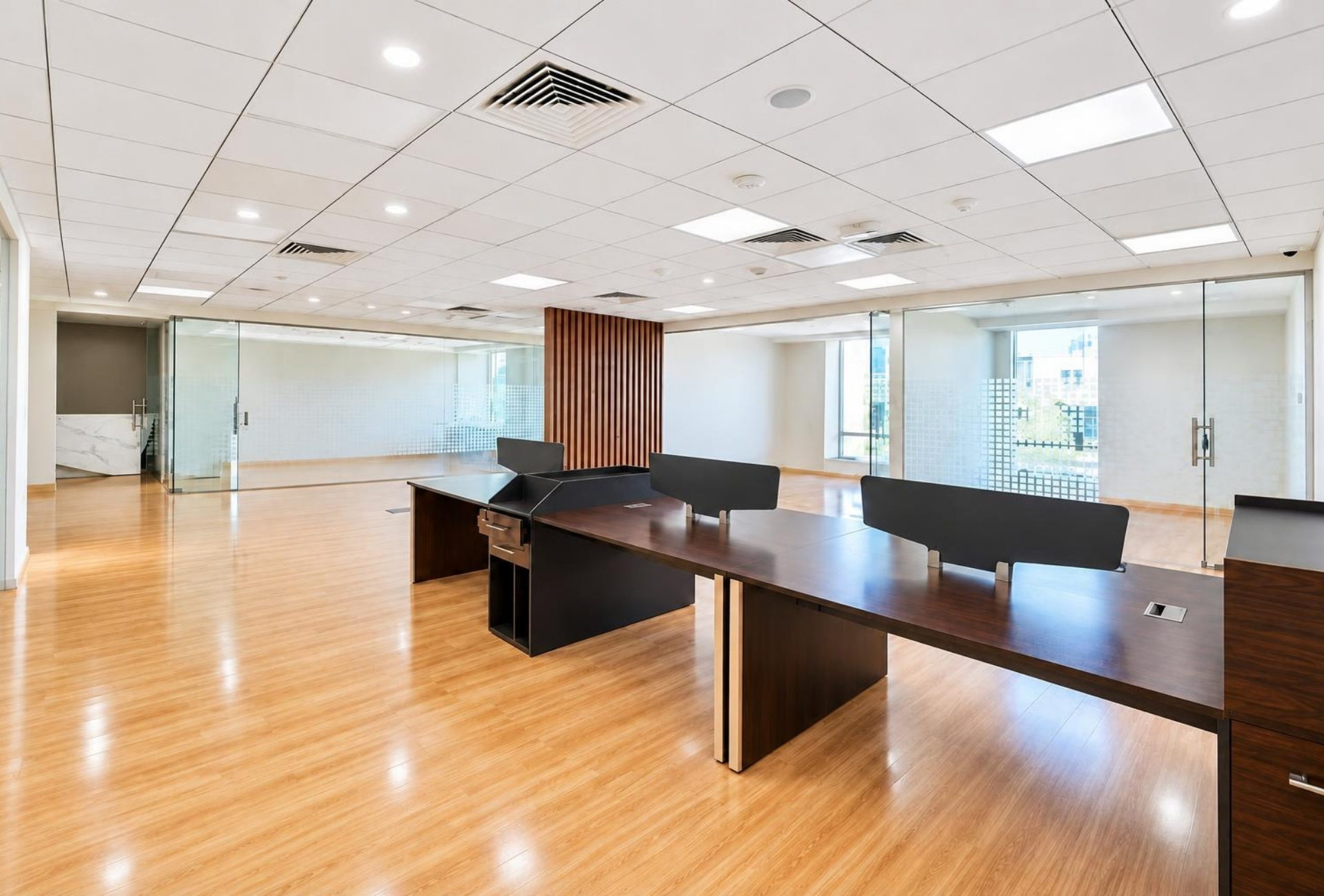 Desk area with glass meeting rooms in Rigga Business Center
