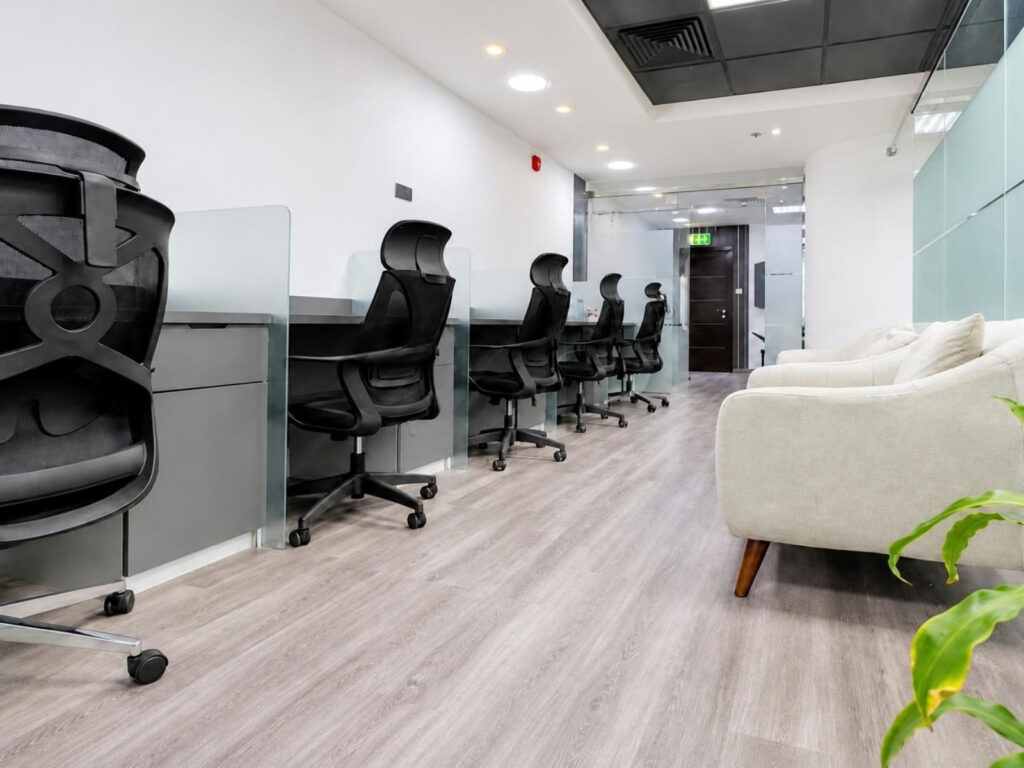 Furnished office for rent in The Prism, Business Bay – meeting room and open workspace