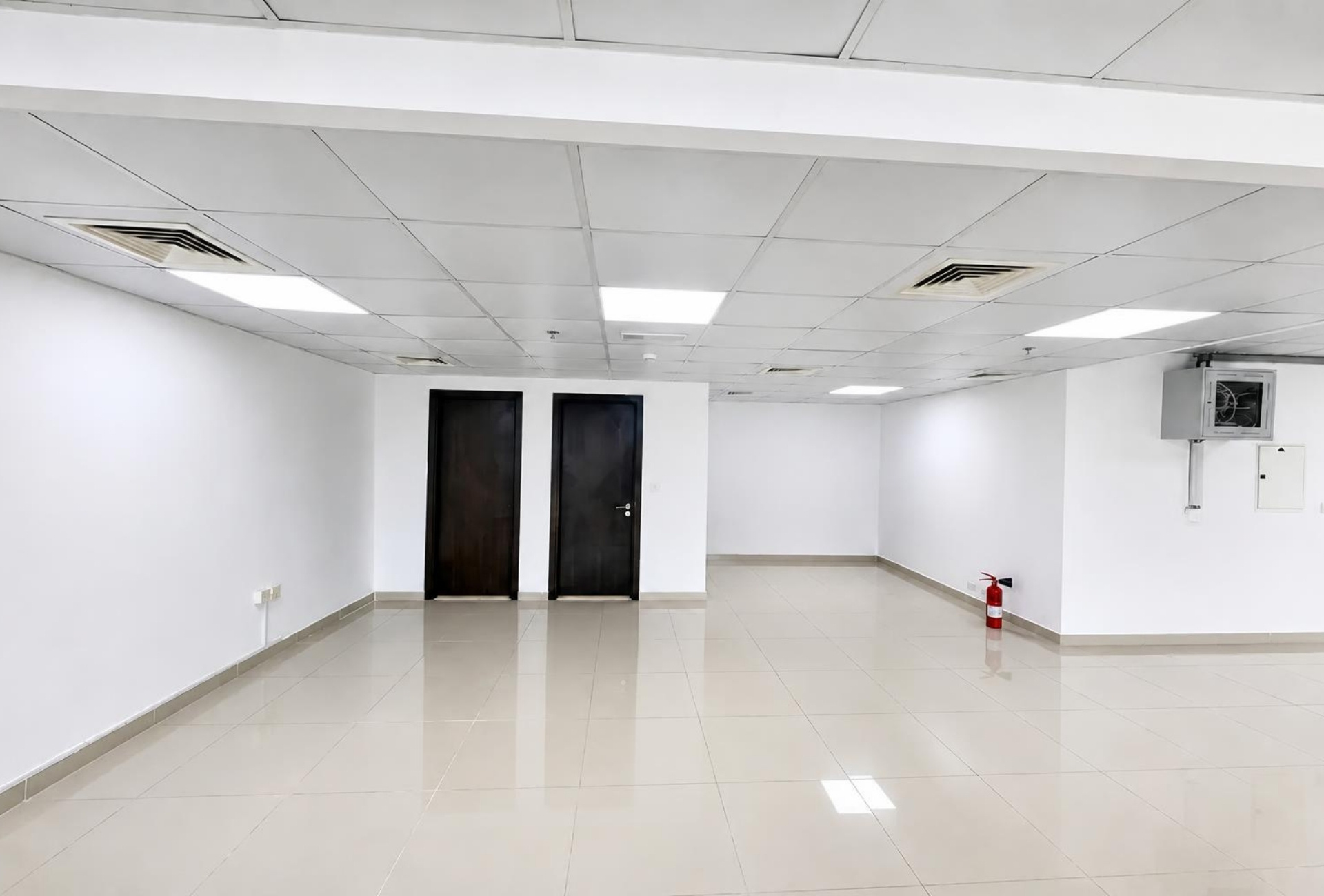 Open floor with dark wood doors in the Platinum Tower office